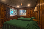 green bedspreads on beds in bedroom