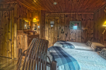 2 beds in wood paneled room